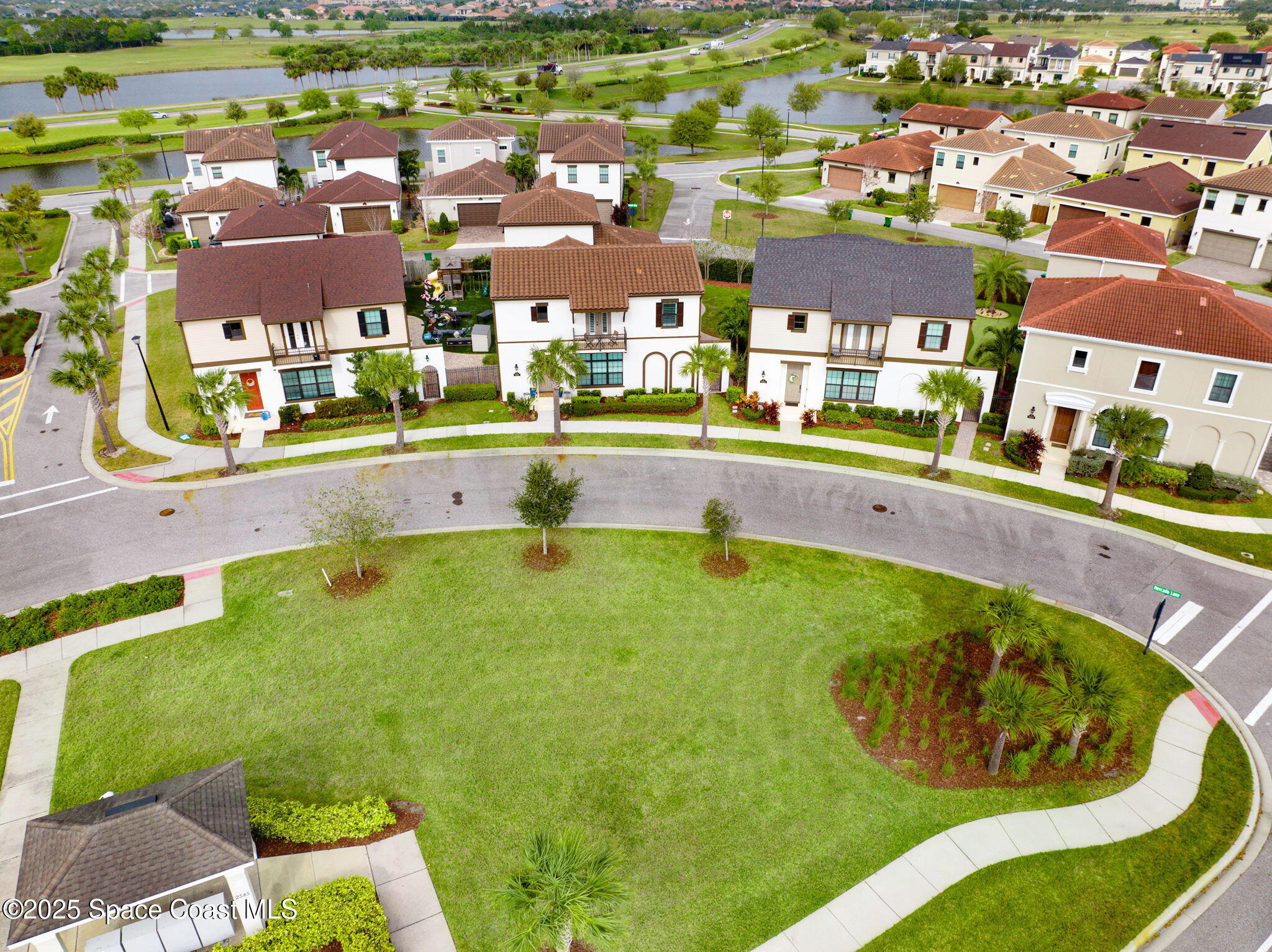 7072 Mercado Lane Melbourne, FL 32940 - Photo 29 of 32 an aerial view of residential houses with outdoor space and swimming pool
