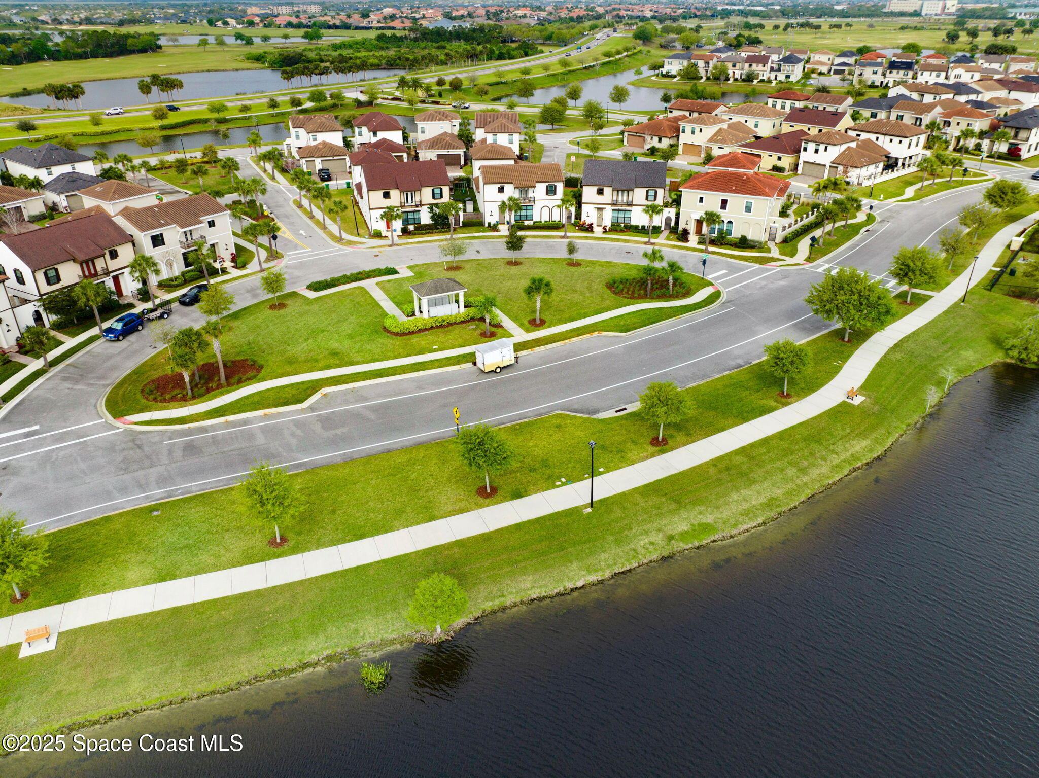 7072 Mercado Lane Melbourne, FL 32940 - Photo 30 of 32 an aerial view of residential houses with outdoor space