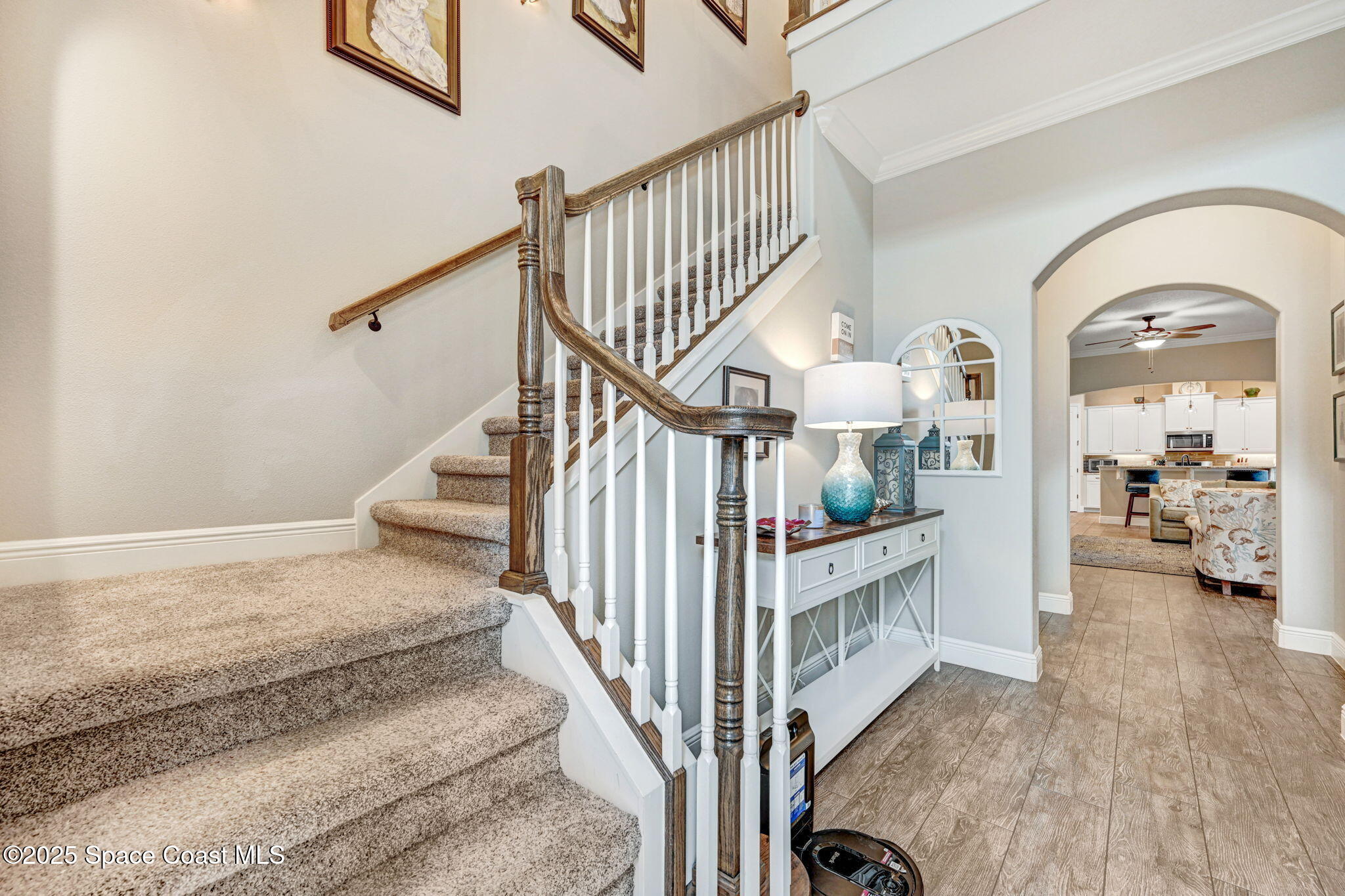 7072 Mercado Lane Melbourne, FL 32940 - Photo 3 of 32 a view of staircase with living area