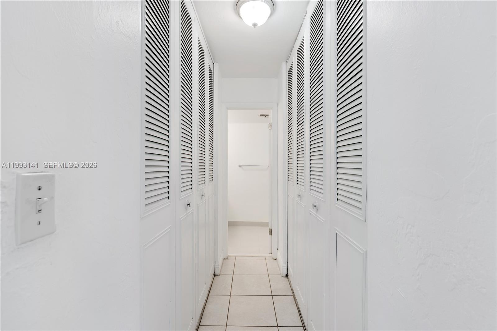 9423 Southwest 76th Street, Unit W21 Miami, FL 33173 - Photo 6 of 13 an entryway with a rug