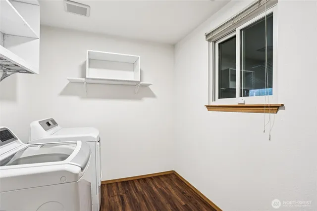 a bathroom with a sink and a window