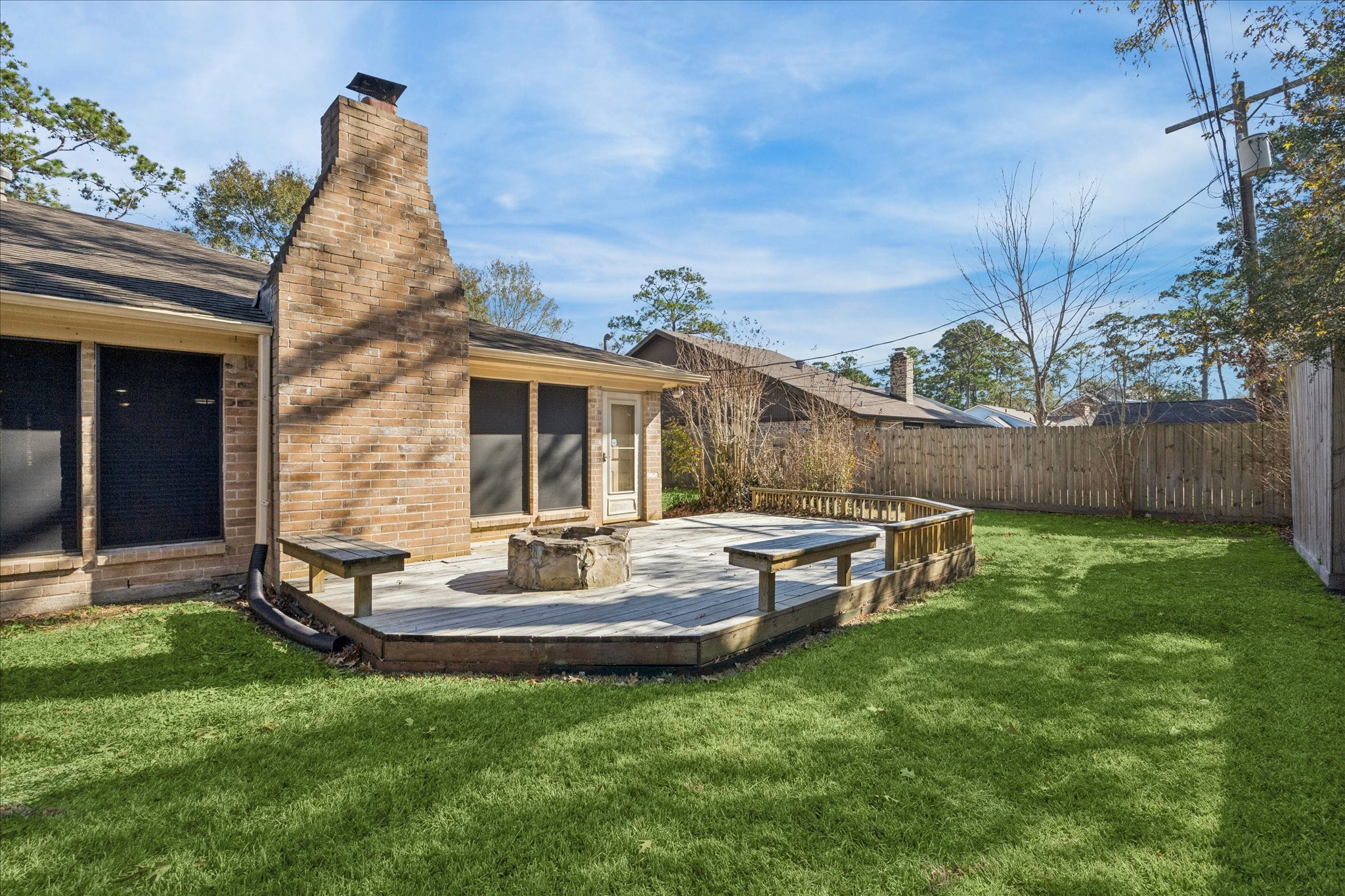 3830 Hansen Drive Dickinson, TX 77539 - Photo 20 of 21 Private Deck / Patio with Stone Fire Pit