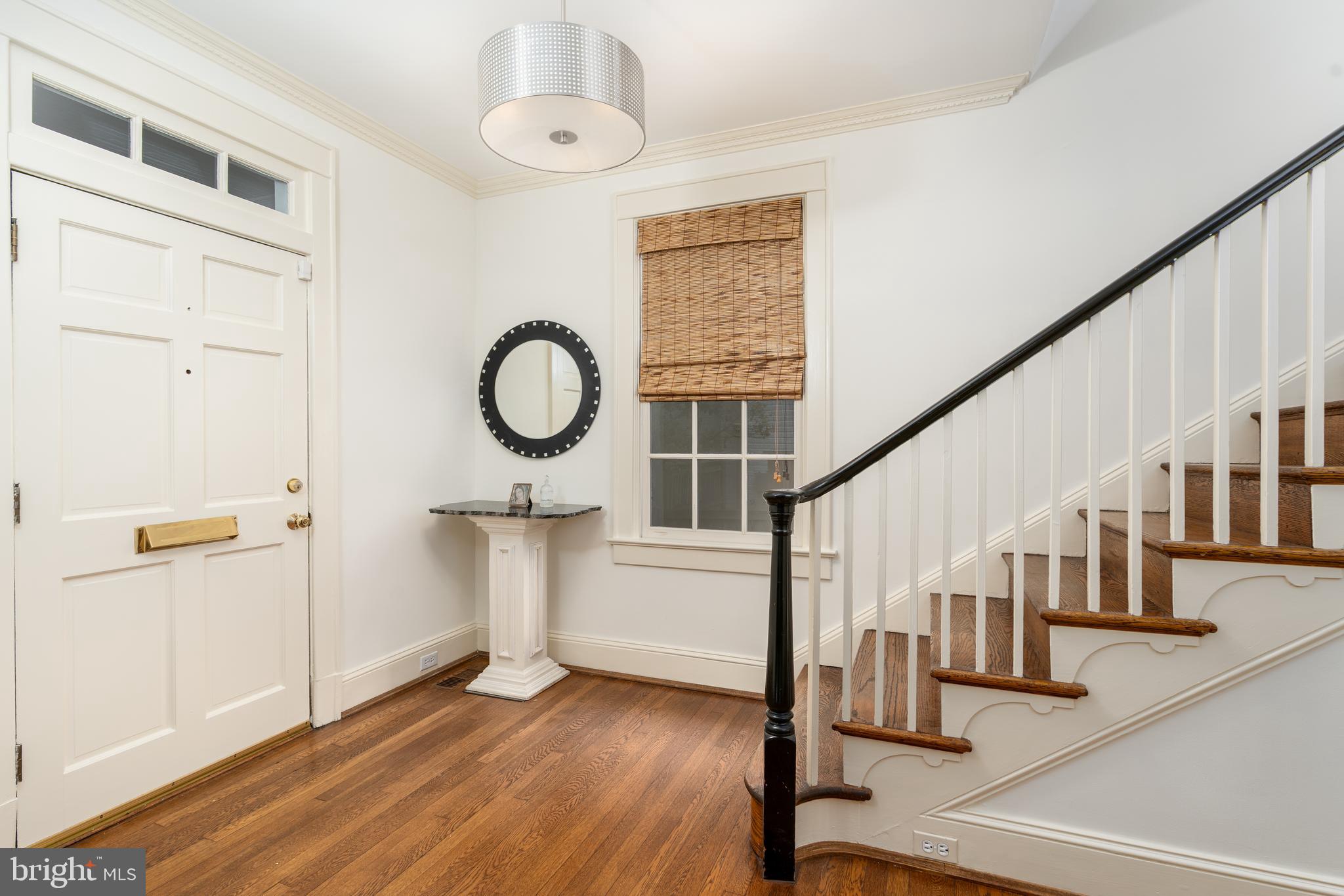 3415 Fulton Street Northwest Washington, DC 20007 - Photo 10 of 68 a view of entryway with wooden floor and staircase