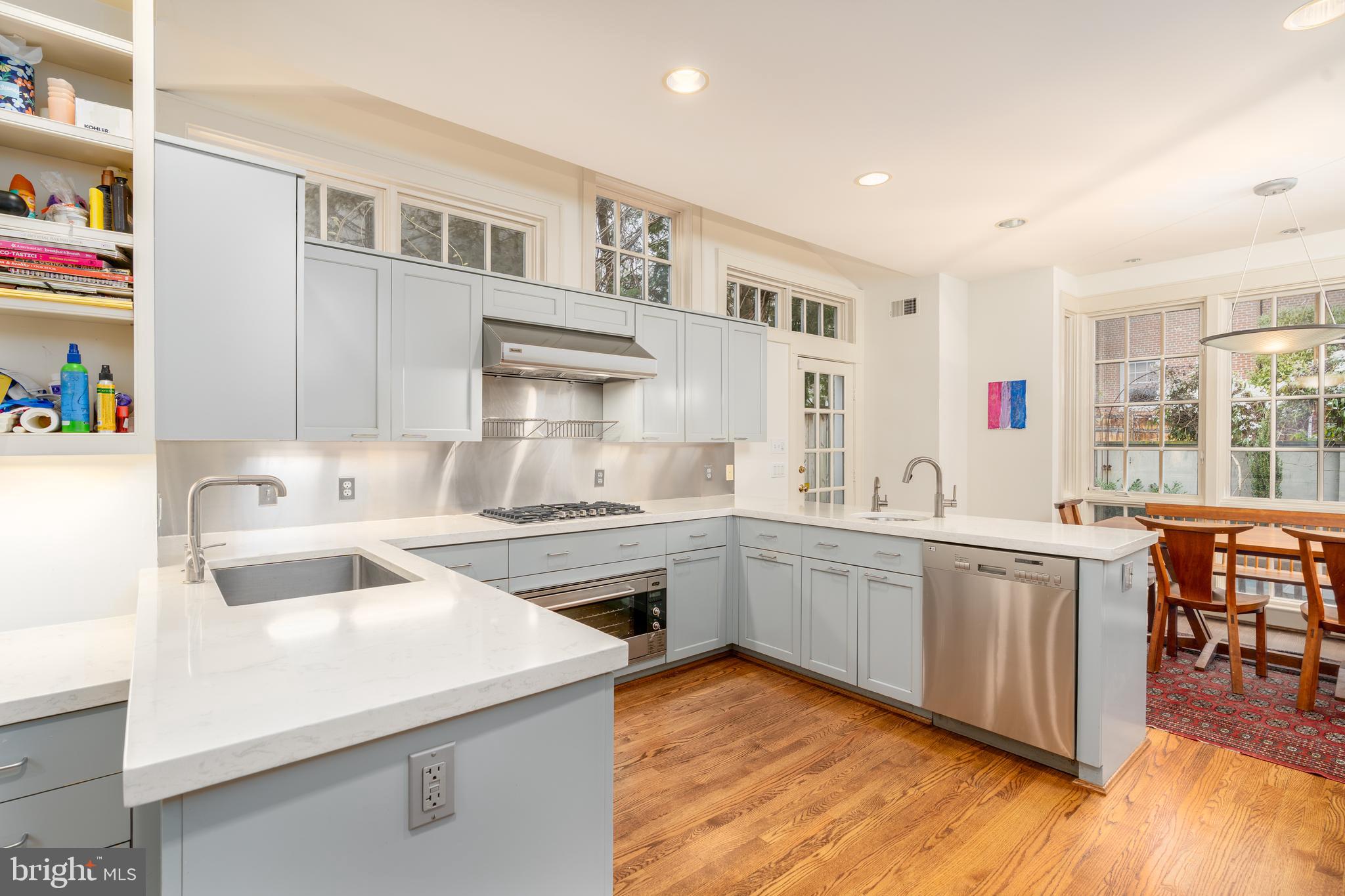 3415 Fulton Street Northwest Washington, DC 20007 - Photo 17 of 68 a kitchen that has a sink and a stove in it