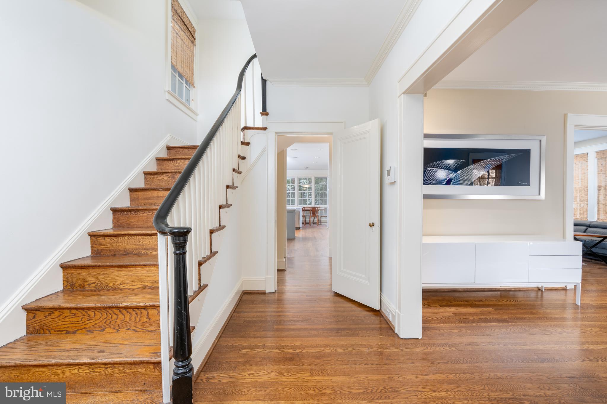 3415 Fulton Street Northwest Washington, DC 20007 - Photo 2 of 68 a view of a hallway with wooden floor and staircase