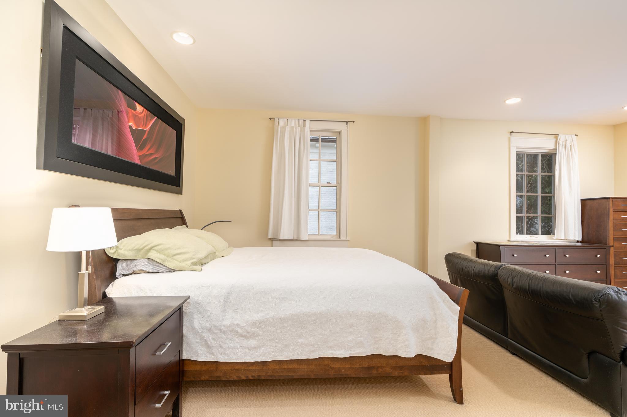 3415 Fulton Street Northwest Washington, DC 20007 - Photo 21 of 68 a bedroom with a bed and a lamp on table
