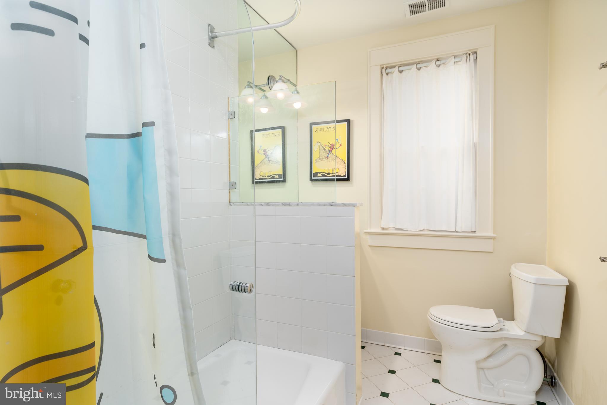 3415 Fulton Street Northwest Washington, DC 20007 - Photo 38 of 68 a bathroom with a toilet sink and mirror