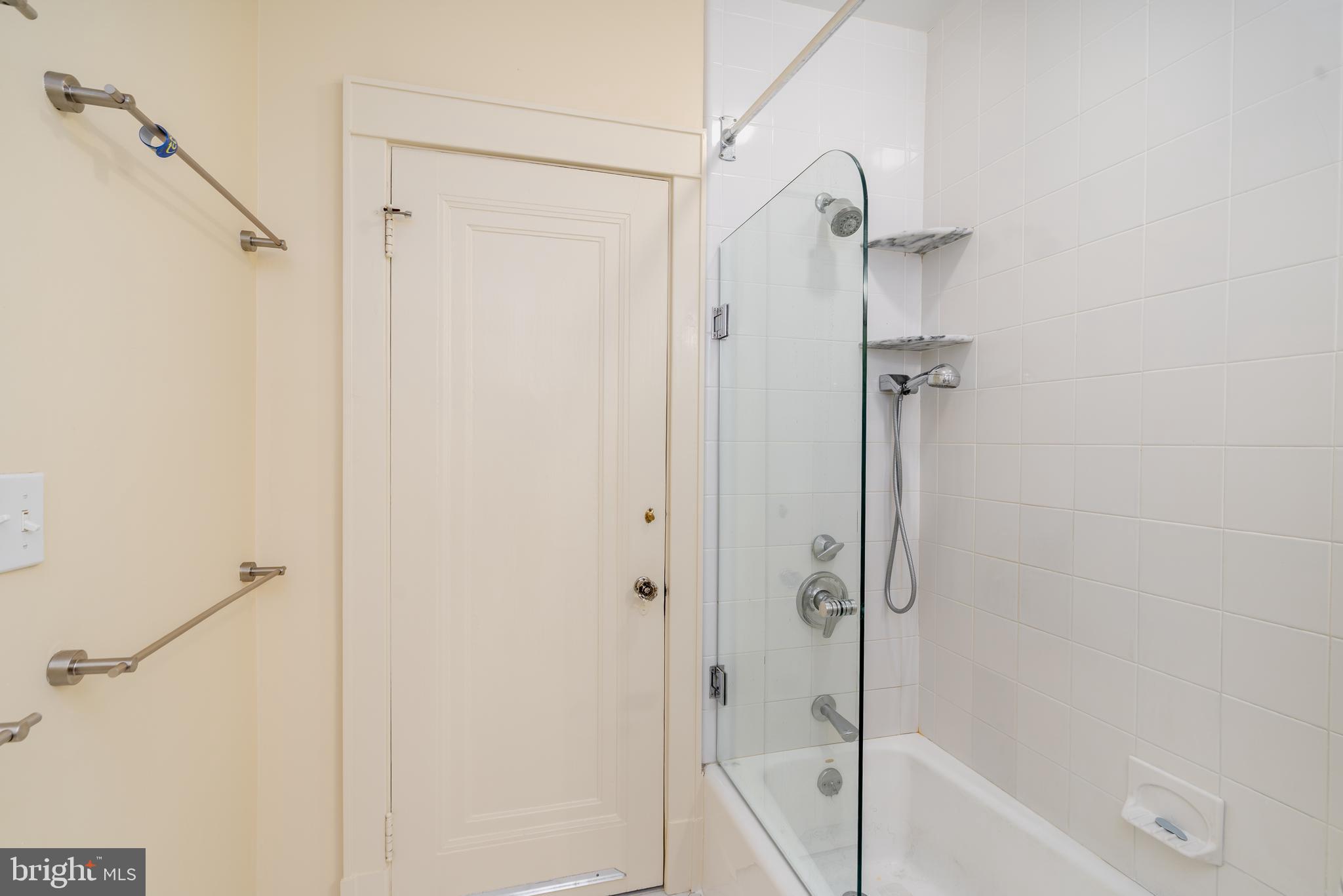 3415 Fulton Street Northwest Washington, DC 20007 - Photo 40 of 68 a bathroom with a tub shower vanity and a sink