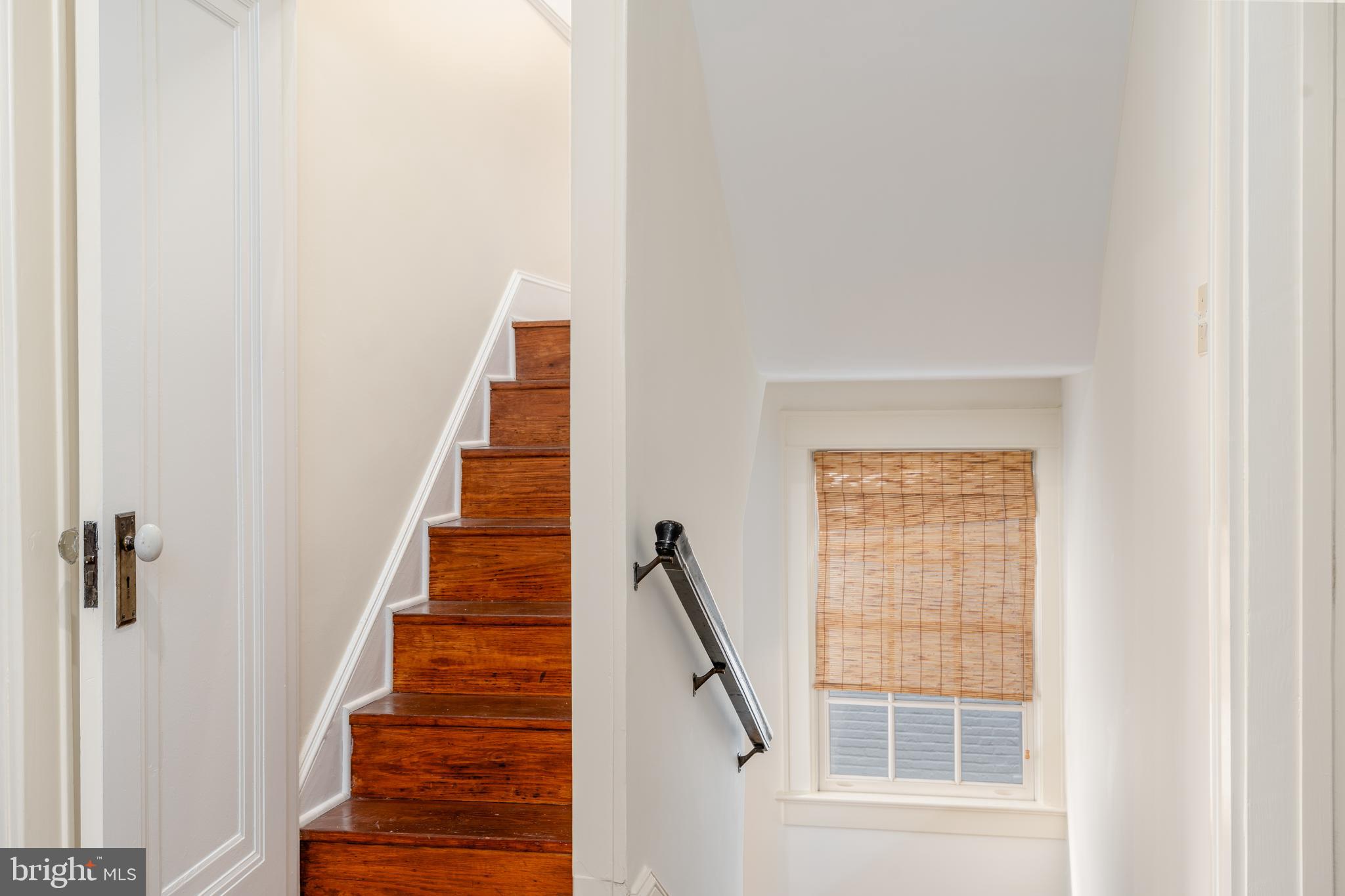 3415 Fulton Street Northwest Washington, DC 20007 - Photo 41 of 68 a view of staircase with wooden floor and a window