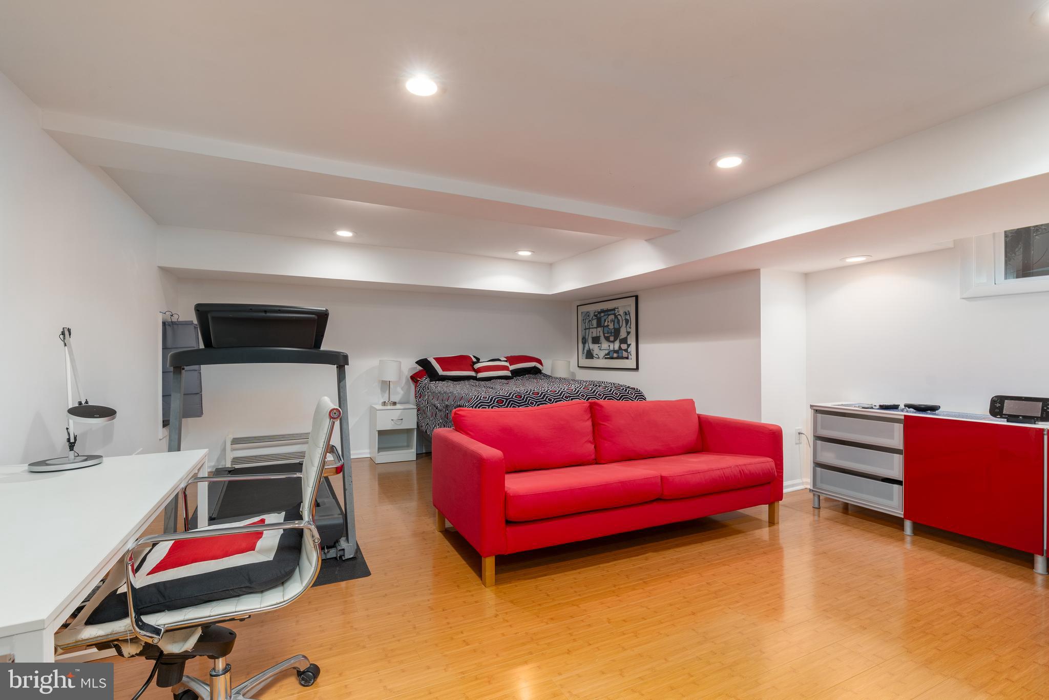 3415 Fulton Street Northwest Washington, DC 20007 - Photo 50 of 68 a livingroom with furniture and a flat screen tv