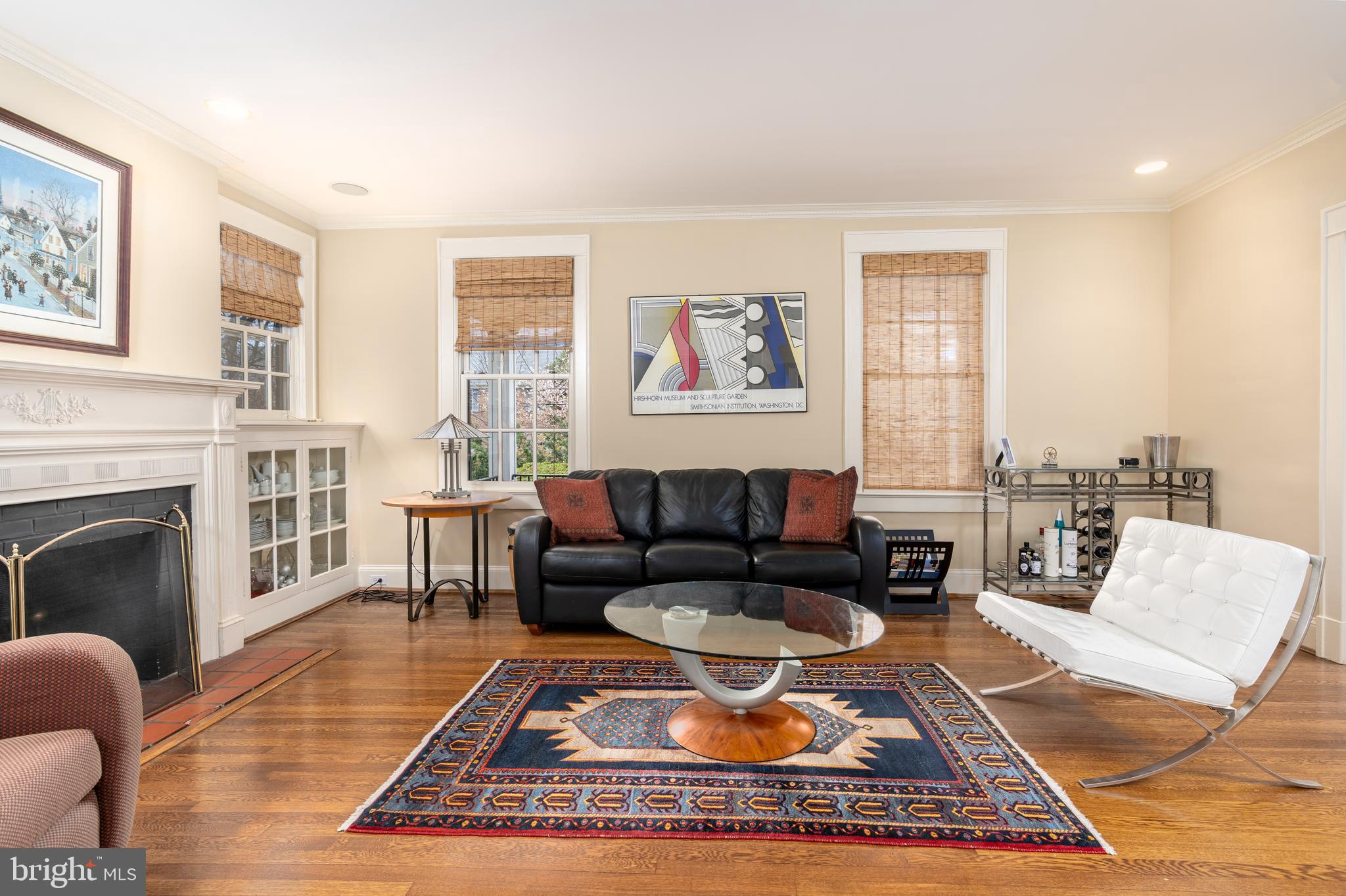 3415 Fulton Street Northwest Washington, DC 20007 - Photo 9 of 68 a living room with furniture a rug a fireplace and windows