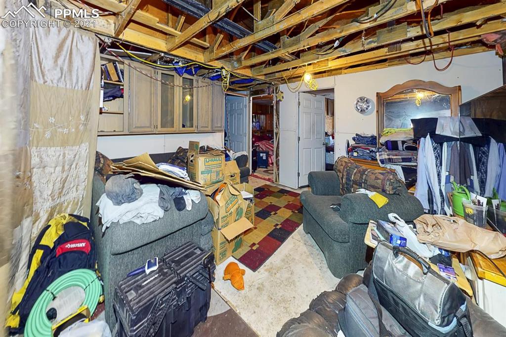 511 Buffalo Street Simla, CO 80835 - Photo 11 of 17 a living room with furniture and a couch