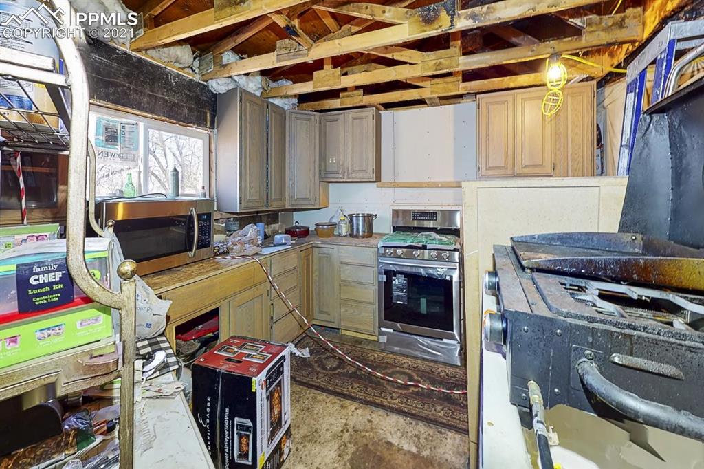 511 Buffalo Street Simla, CO 80835 - Photo 7 of 17 a room with furniture a flat screen tv and a fireplace