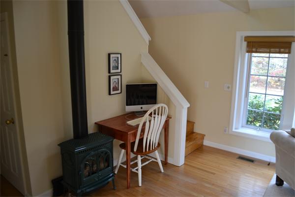 87 Schoolhouse Road, Unit 87 Edgartown, MA 02539 - Photo 12 of 17 a view of dining room and livingroom with furniture wooden floor windows and entryway