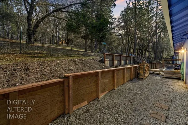 a backyard of a house with a yard with outdoor seating