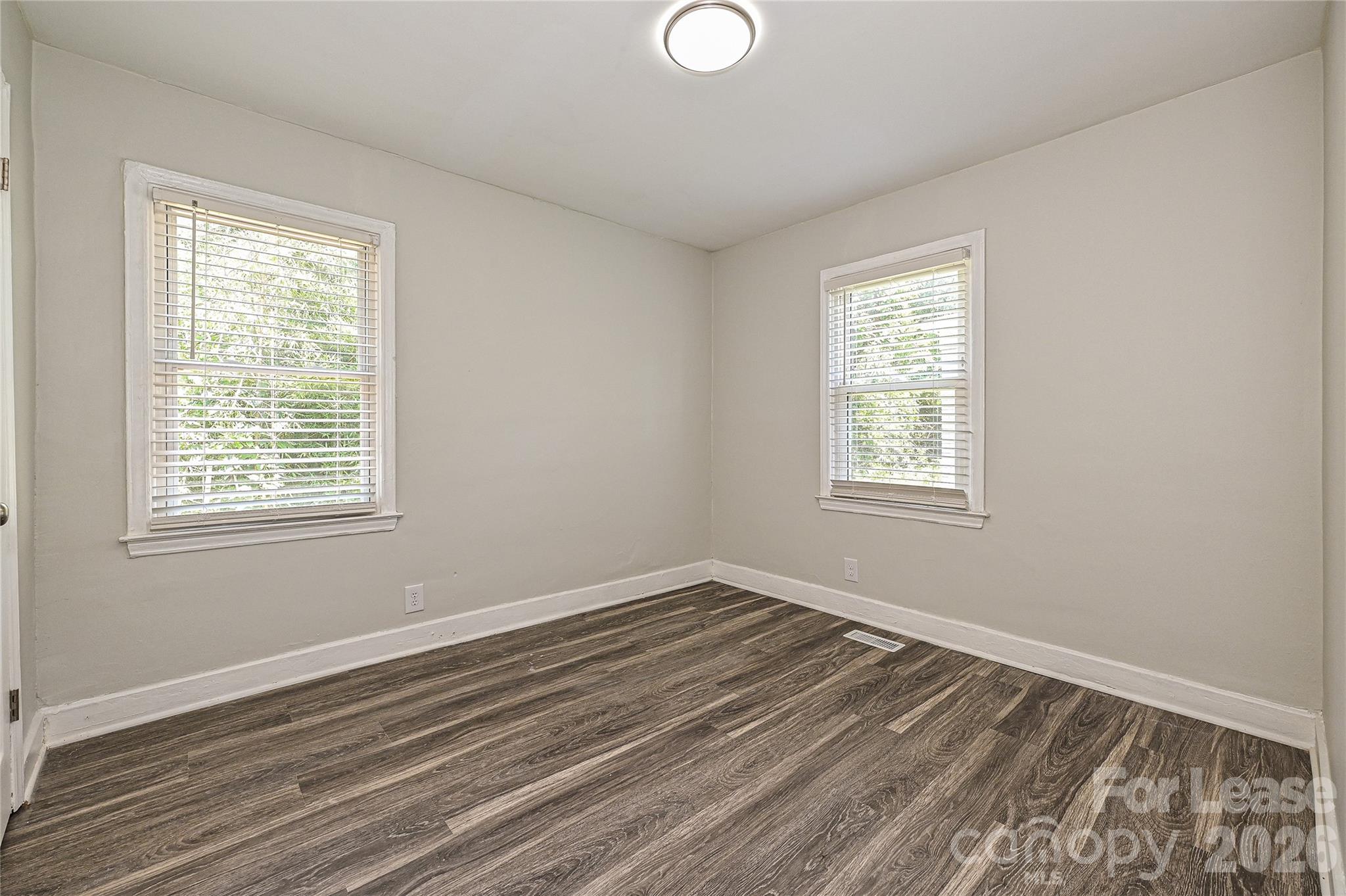 3429 Tappan Place, Unit 2 Charlotte, NC 28205 - Photo 13 of 16 a view of a room with wooden floor and windows