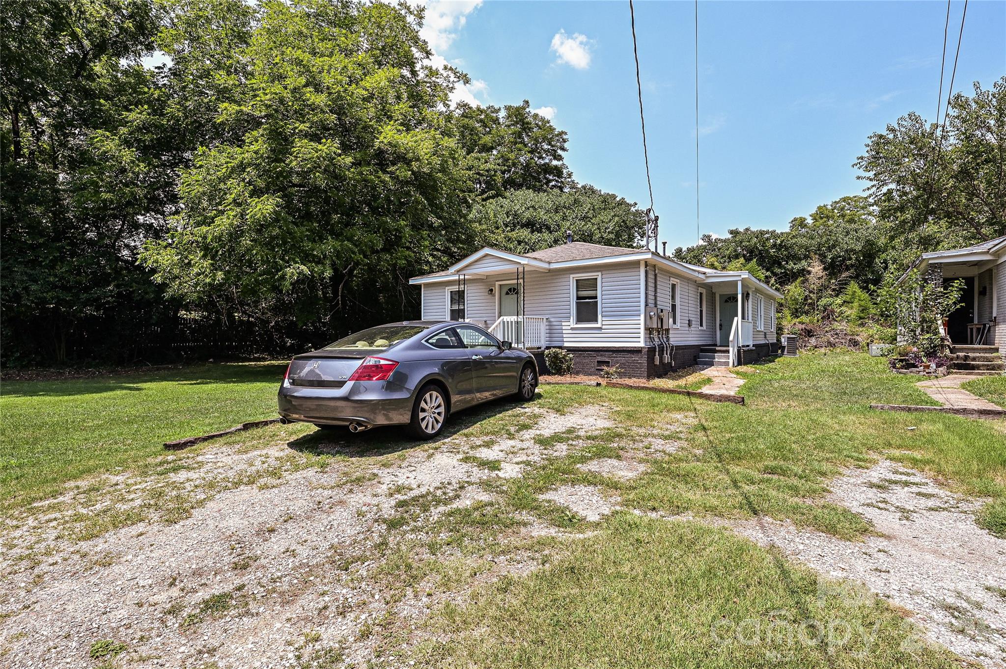 3429 Tappan Place, Unit 2 Charlotte, NC 28205 - Photo 16 of 16 a view of a house with a yard and sitting area
