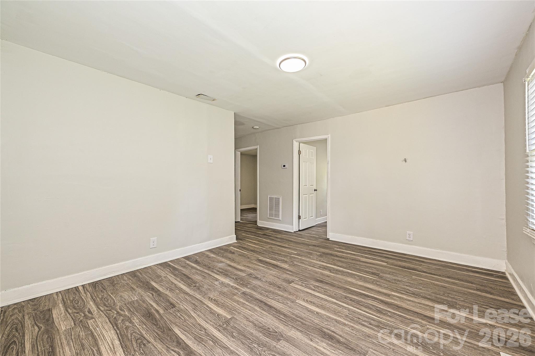 3429 Tappan Place, Unit 2 Charlotte, NC 28205 - Photo 2 of 16 a view of an empty room with wooden floor