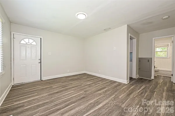 a kitchen with a refrigerator and a sink
