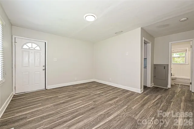 a kitchen with a refrigerator and a sink