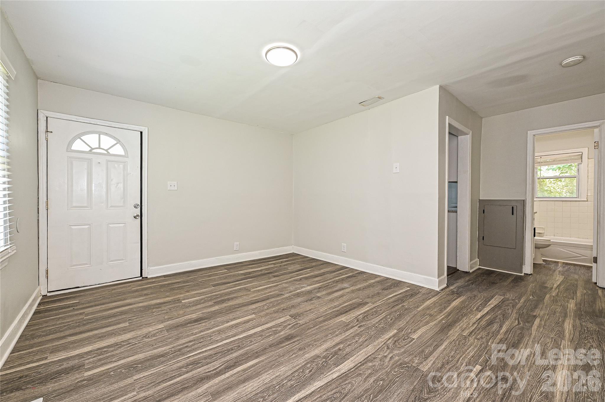 3429 Tappan Place, Unit 2 Charlotte, NC 28205 - Photo 5 of 16 wooden floor in an empty room