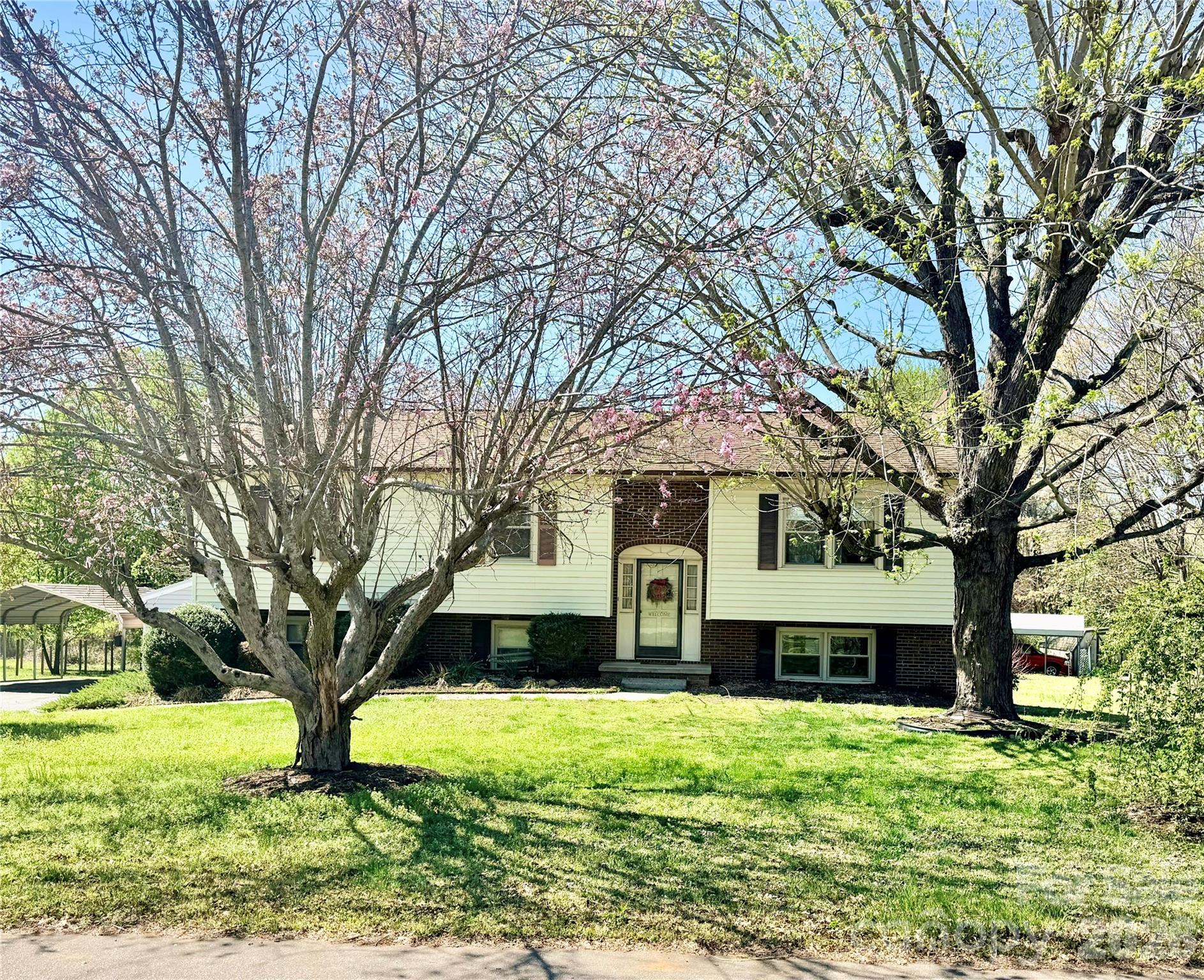 a front view of a house with a yard