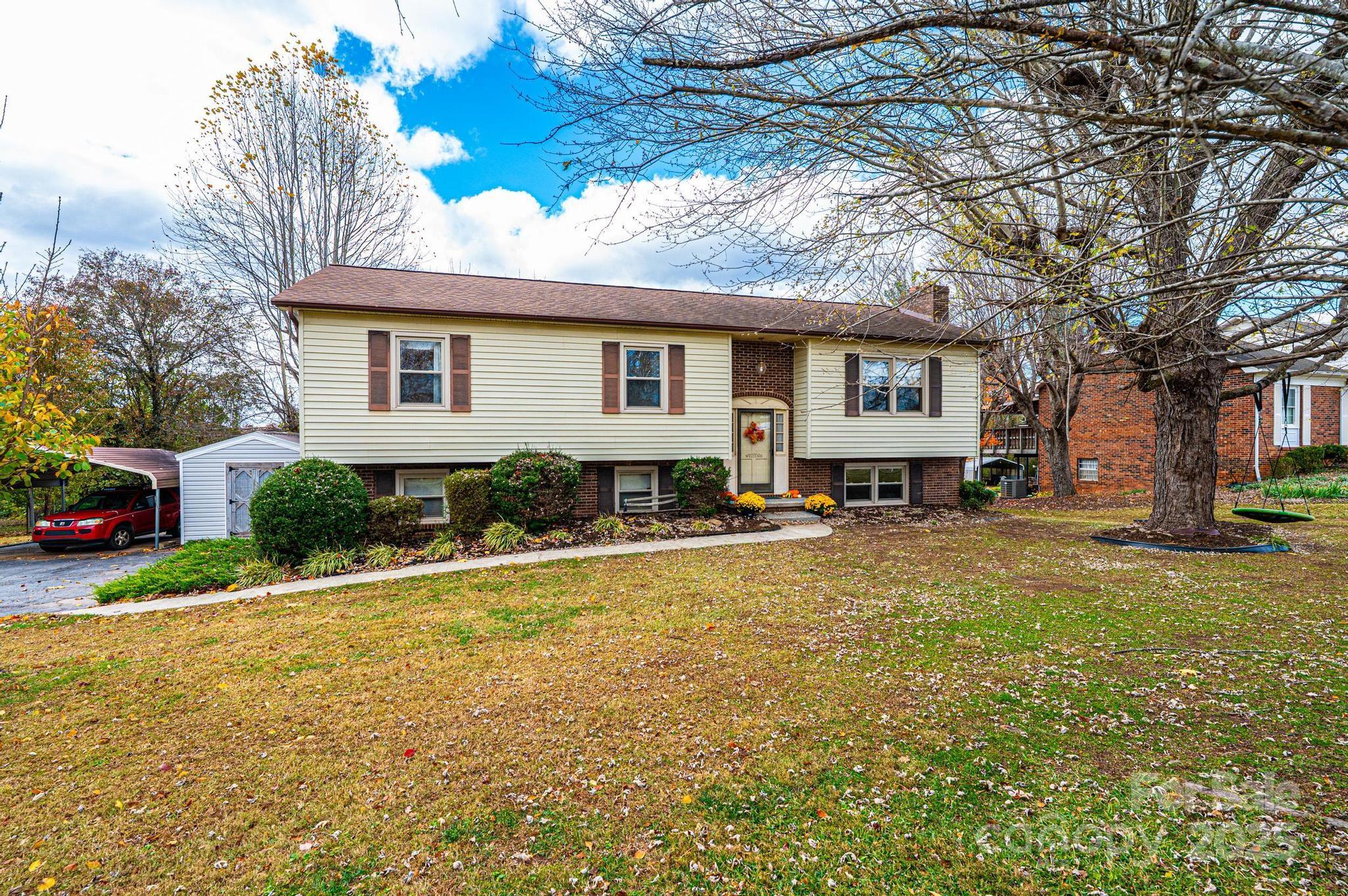 a house view with a sitting space and garden