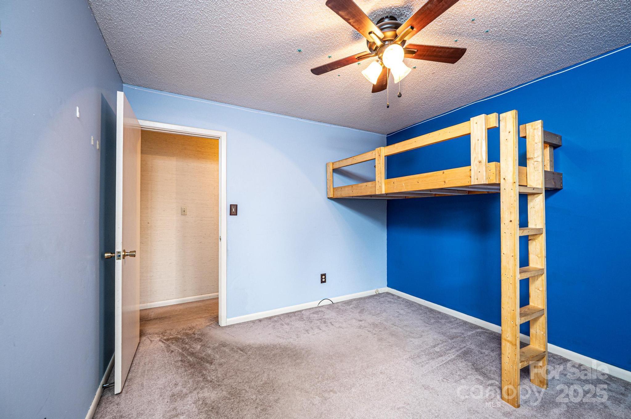 2570 Raintree Street Connelly Springs, NC 28612 - Photo 17 of 37 a view of a livingroom with a ceiling fan and window