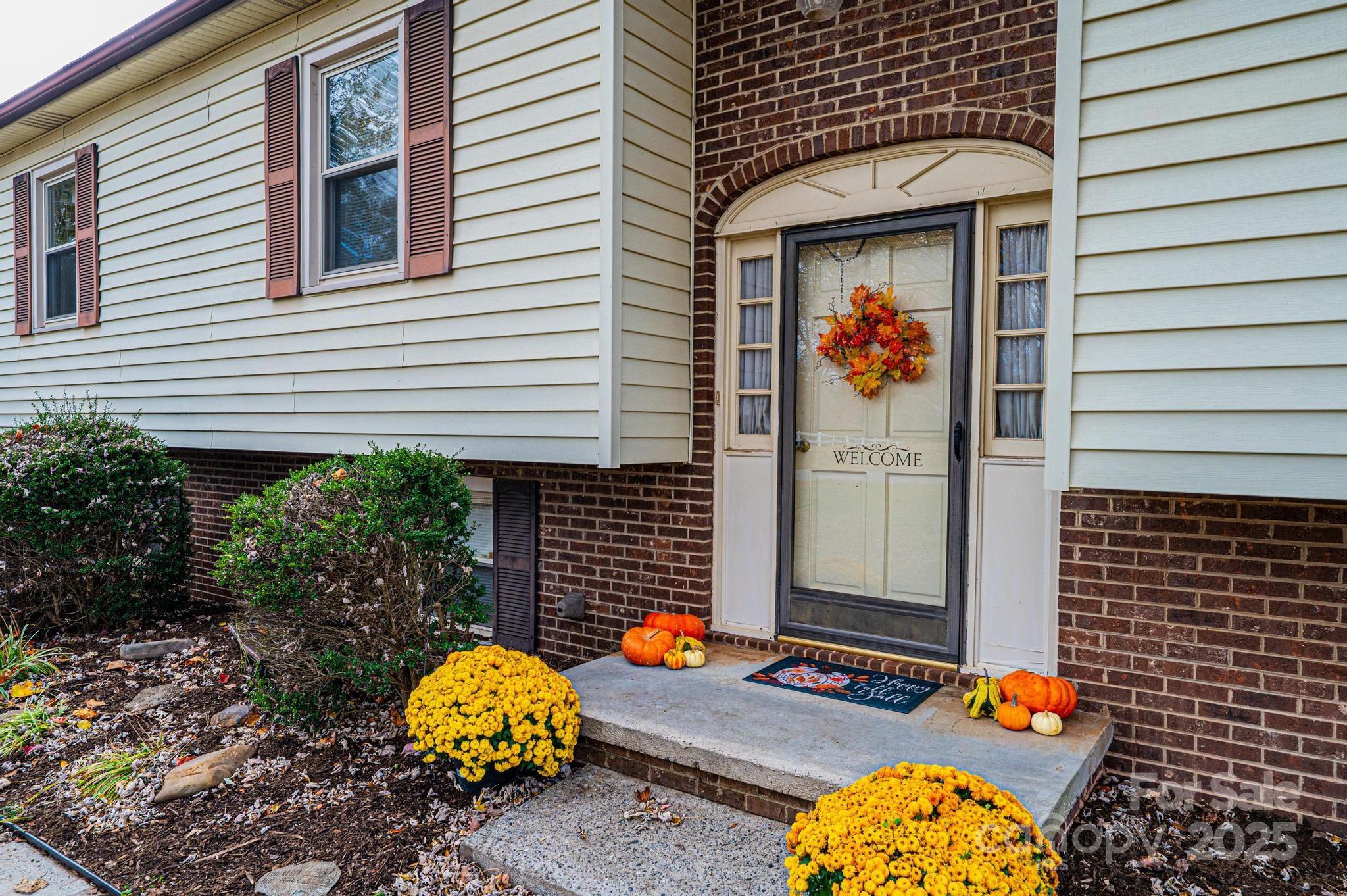 2570 Raintree Street Connelly Springs, NC 28612 - Photo 2 of 37 a front view of a house with an outdoor space