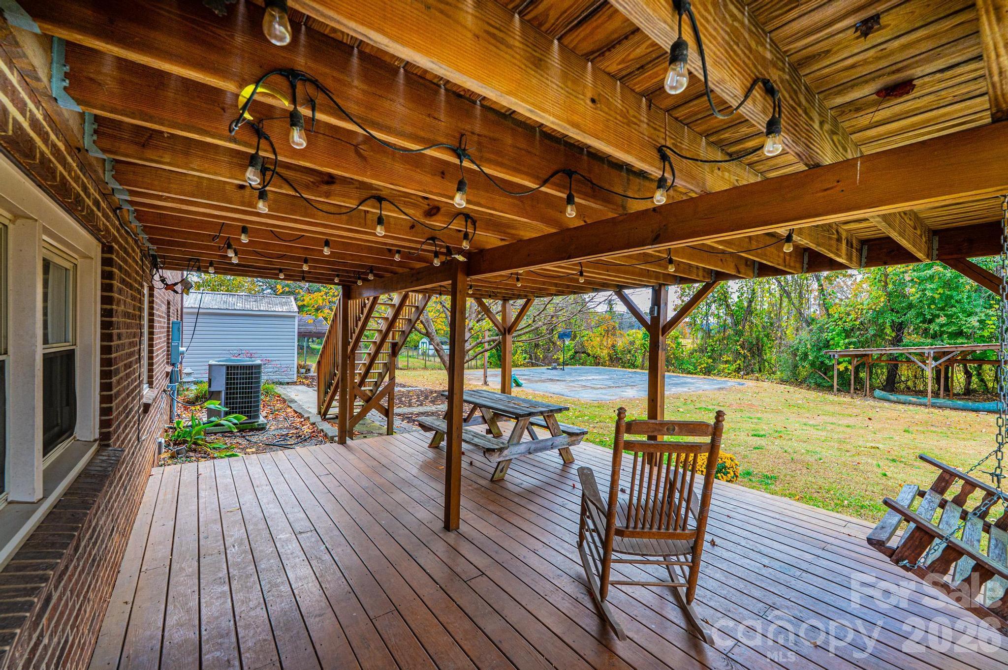 2570 Raintree Street Connelly Springs, NC 28612 - Photo 27 of 39 a view of a patio with swimming pool table and chairs