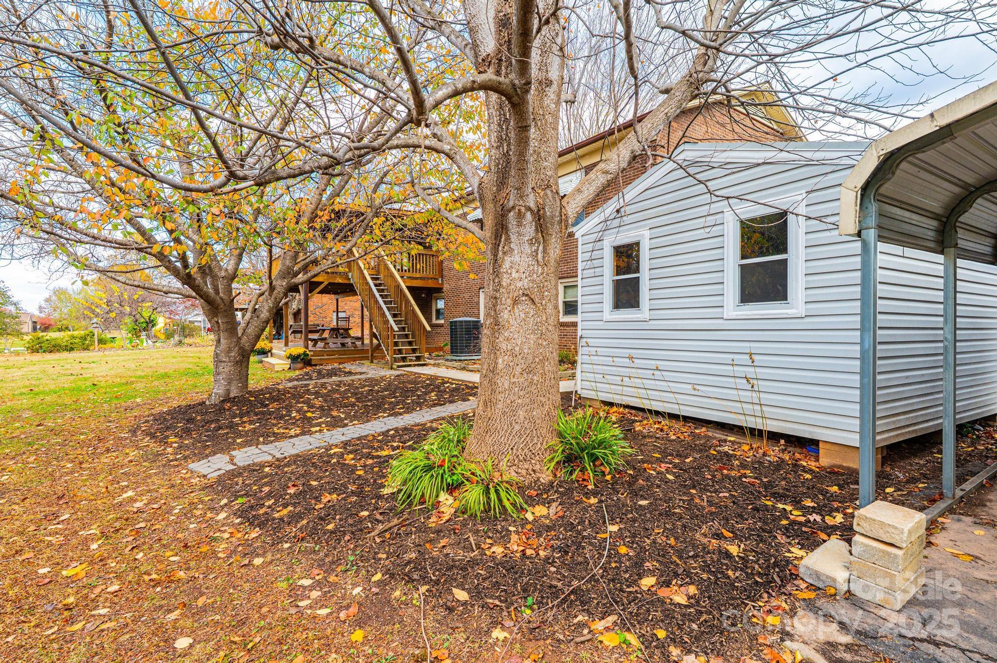 2570 Raintree Street Connelly Springs, NC 28612 - Photo 30 of 37 a front view of a house with garden
