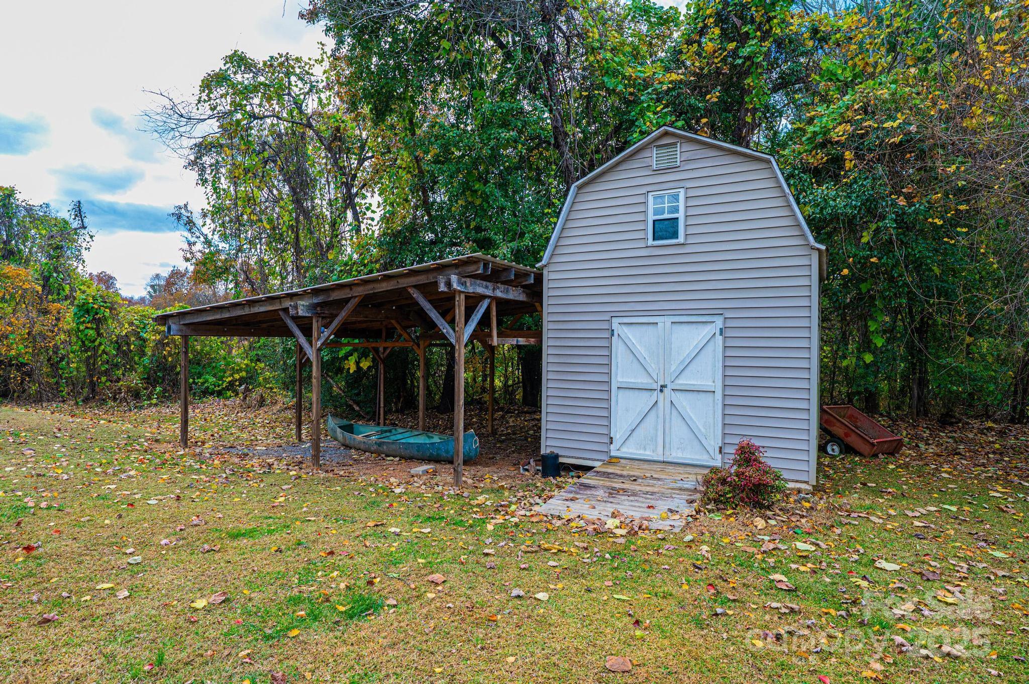 2570 Raintree Street Connelly Springs, NC 28612 - Photo 33 of 37 a view of house with backyard and glass windows