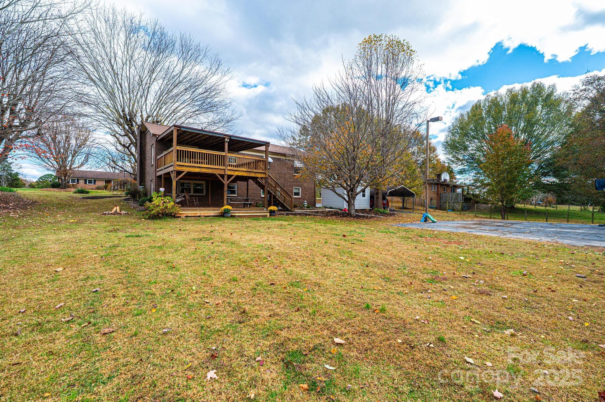 2570 Raintree Street Connelly Springs, NC 28612 - Photo 34 of 37 a view of a house with a yard and garage