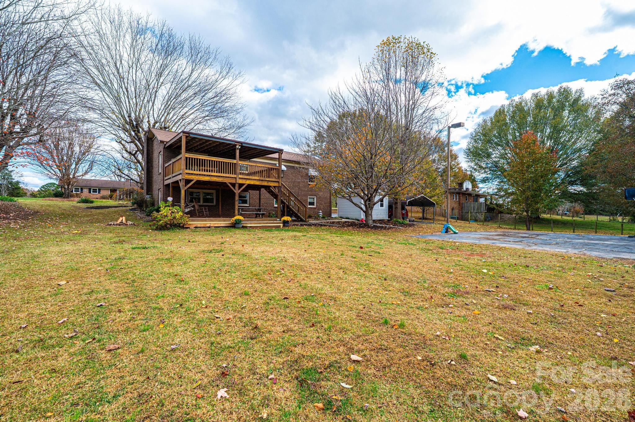 2570 Raintree Street Connelly Springs, NC 28612 - Photo 35 of 39 a view of a house with a yard and garage