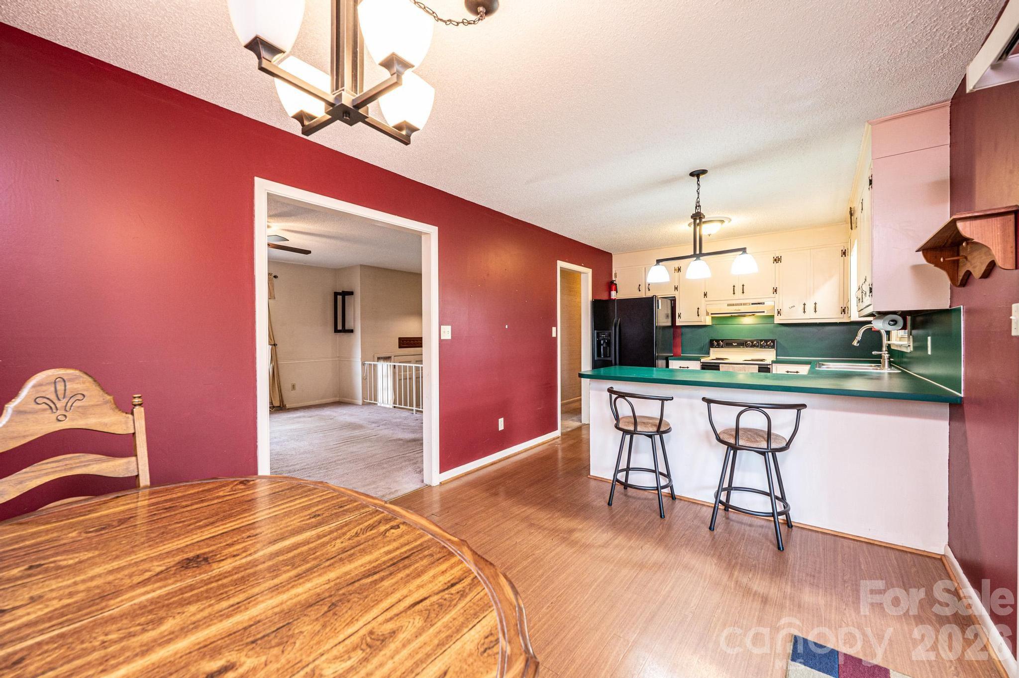 2570 Raintree Street Connelly Springs, NC 28612 - Photo 7 of 39 a bedroom with a bed and a table chair