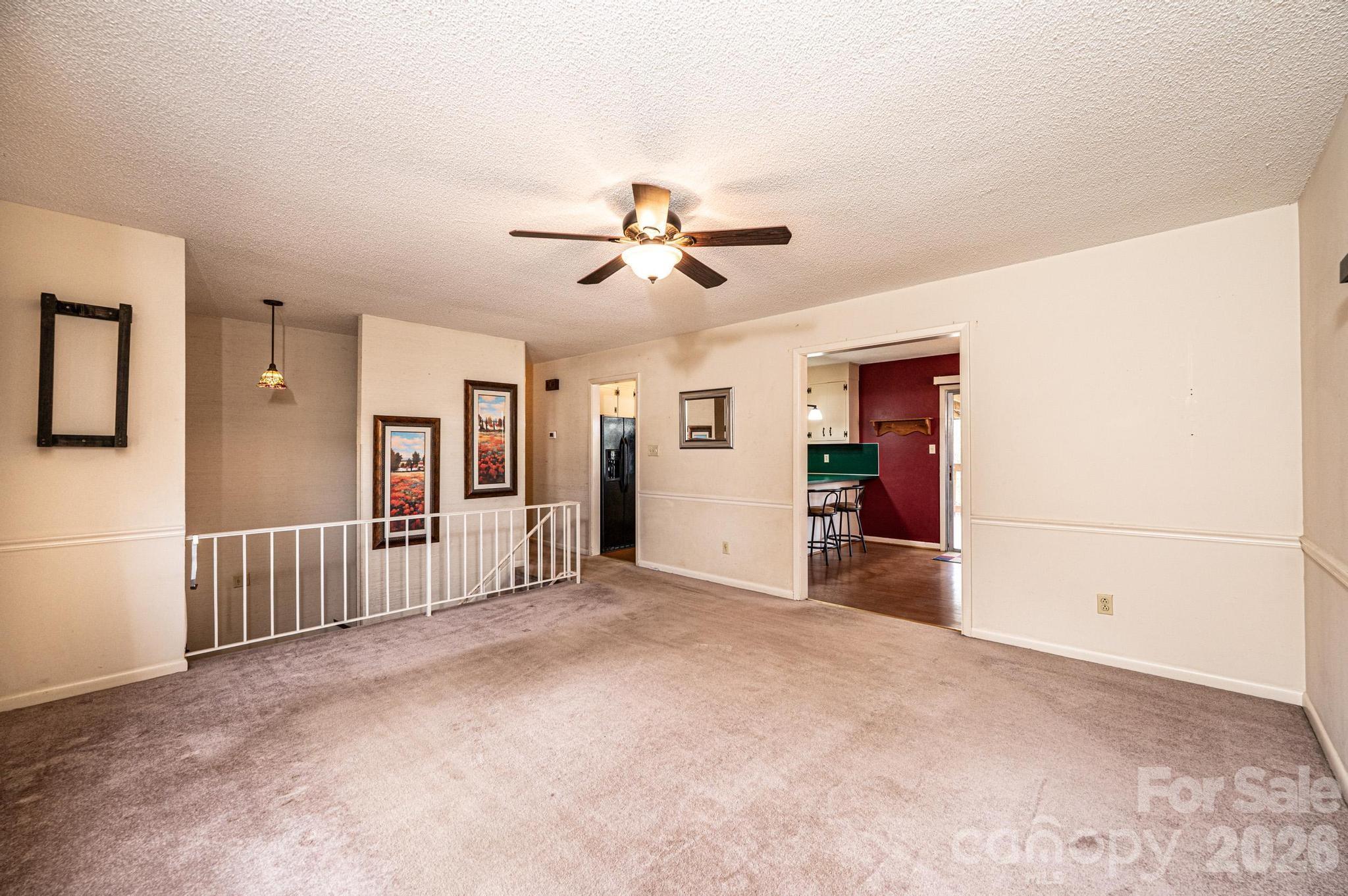 2570 Raintree Street Connelly Springs, NC 28612 - Photo 9 of 39 an empty room with closet and a ceiling fan