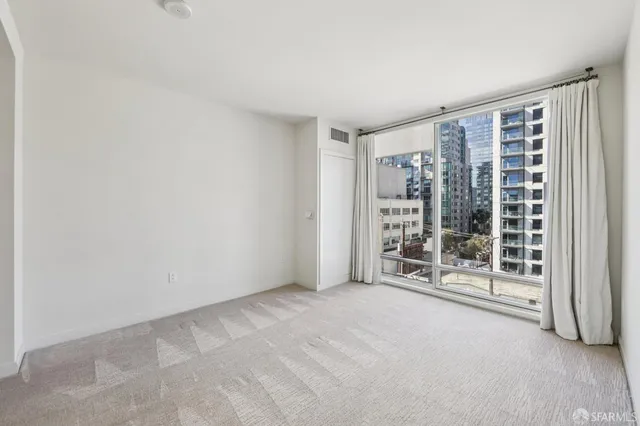 a view of water heater room with a fireplace