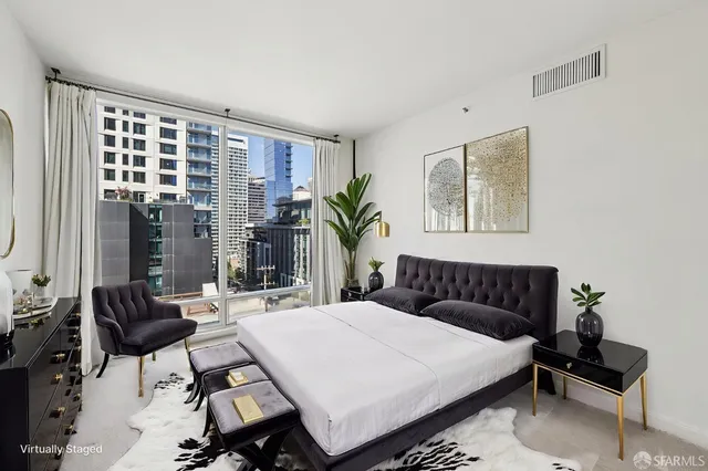 a room with lots of furniture and wooden floor