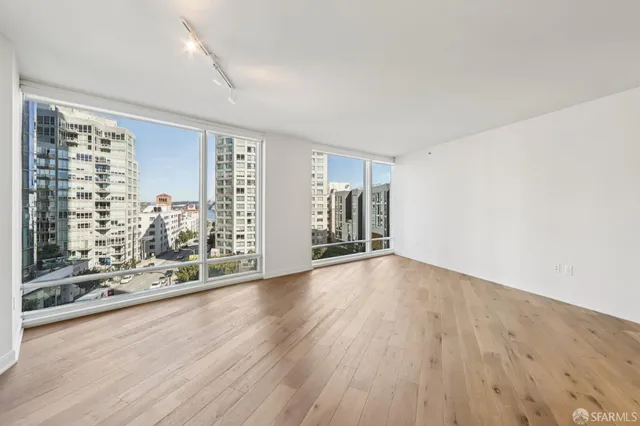 a kitchen with stainless steel appliances kitchen island granite countertop a refrigerator and microwave
