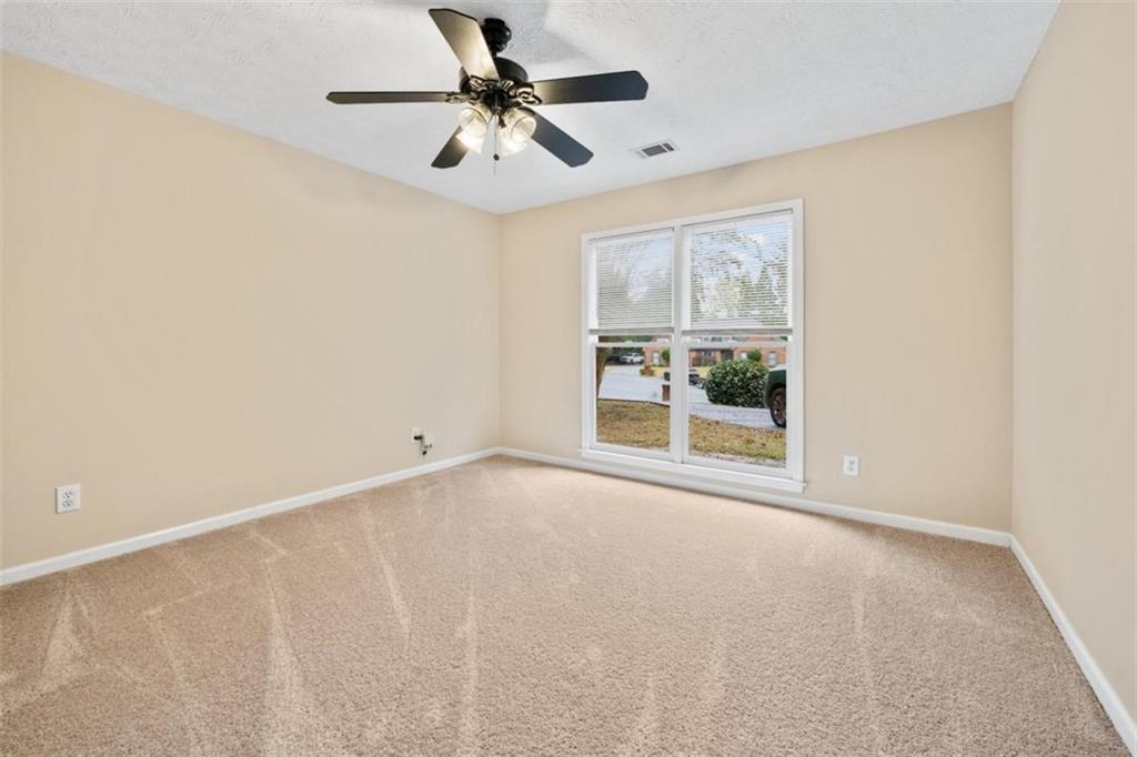 2985 Ashton Pointe Circle Dacula, GA 30019 - Photo 23 of 47 a view of an empty room with a window
