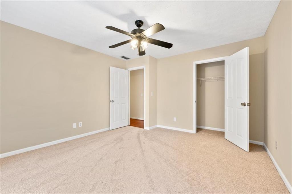 2985 Ashton Pointe Circle Dacula, GA 30019 - Photo 24 of 47 a view of empty room with wooden floor