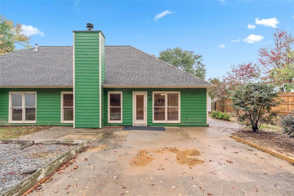 2985 Ashton Pointe Circle Dacula, GA 30019 - Photo 34 of 47 a front view of a house with a garden and yard