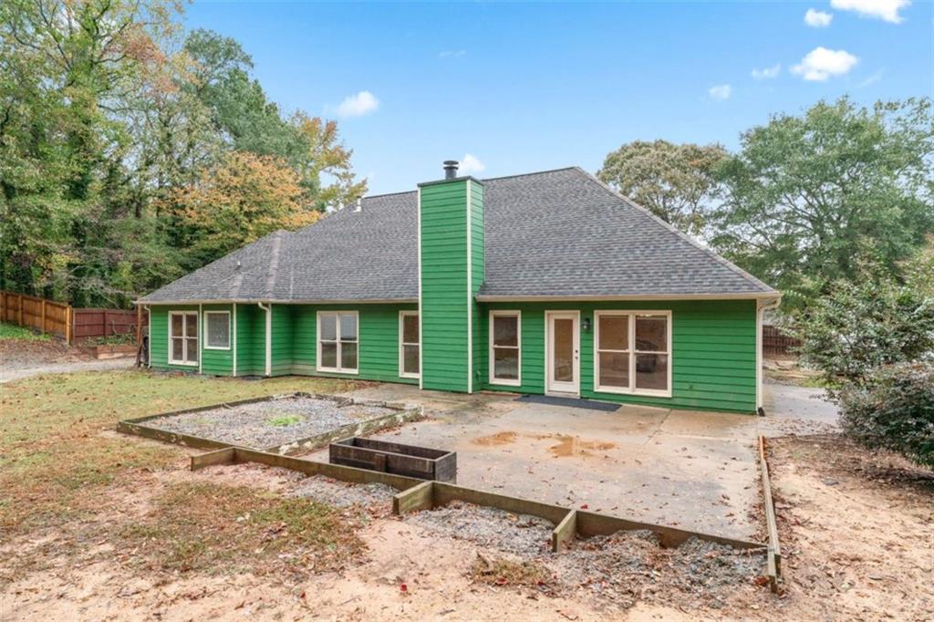 2985 Ashton Pointe Circle Dacula, GA 30019 - Photo 35 of 47 a front view of a house with a garden and patio