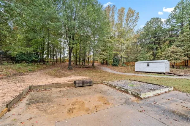 a backyard of a house with a yard and garage