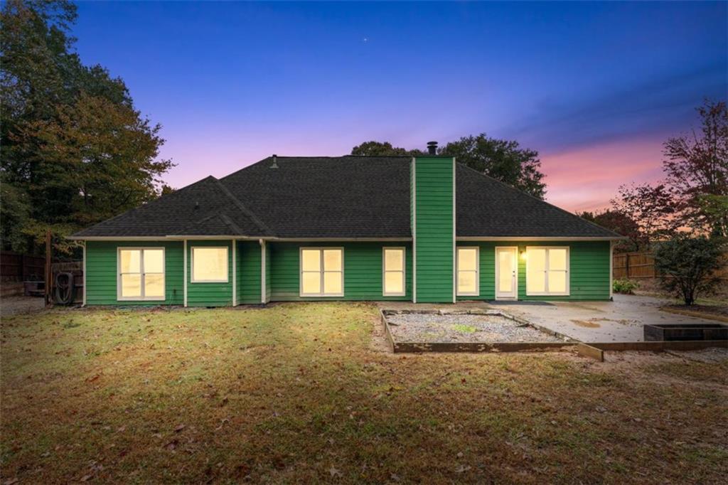 2985 Ashton Pointe Circle Dacula, GA 30019 - Photo 40 of 47 a front view of a house with a yard and garage