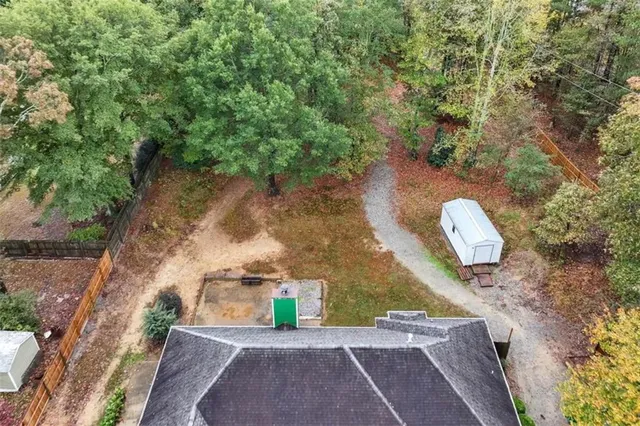 a view of a house with a yard and garden
