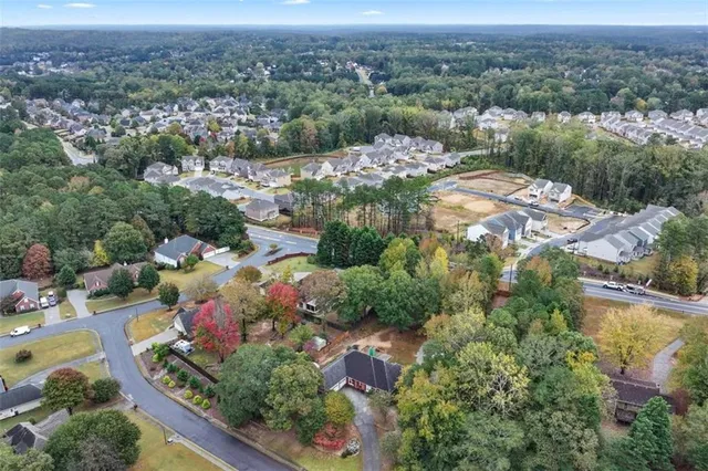 an aerial view of residential house with outdoor space and swimming pool