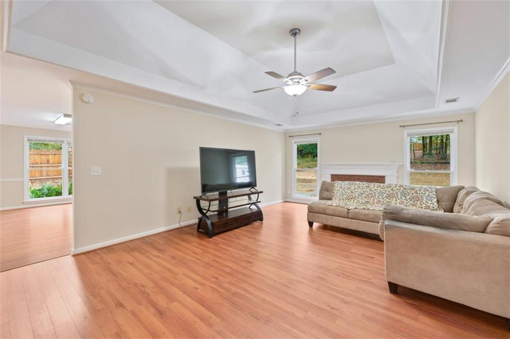 2985 Ashton Pointe Circle Dacula, GA 30019 - Photo 8 of 47 a living room with furniture and a flat screen tv