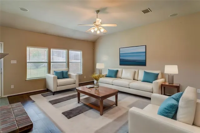 a living room with furniture and a window