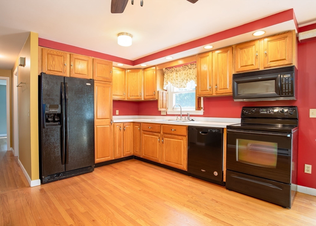 60 Saffron Circle Springfield, MA 01129 - Photo 4 of 37 a kitchen with stainless steel appliances a stove a refrigerator and a sink